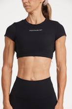 Load image into Gallery viewer, Buttery soft high waisted women&#39;s gym tights with curved hem stitched detailing for a butt shaping effect, and no front rise seam, paired with an open back women&#39;s crop t-shirt with a supportive elasticated hem and triple layered fabric with removable pads for extra support and aesthetic cross back straps in Black.
