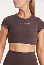 Load image into Gallery viewer, Buttery soft high waisted women&#39;s gym tights with curved hem stitched detailing for a butt shaping effect, and no front rise seam, paired with an open back women&#39;s crop t-shirt with a supportive elasticated hem and triple layered fabric with removable pads for extra support and aesthetic cross back straps in dark chocolate.
