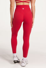 Load image into Gallery viewer, Buttery soft high waisted women&#39;s gym tights with curved hem stitched detailing for a butt shaping effect, and no front rise seam, paired with an open back women&#39;s crop t-shirt with a supportive elasticated hem and triple layered fabric with removable pads for extra support and aesthetic cross back straps in Raspberry red.
