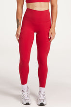 Load image into Gallery viewer, Buttery soft high waisted women&#39;s gym tights with curved hem stitched detailing for a butt shaping effect, and no front rise seam, paired with an open back women&#39;s crop t-shirt with a supportive elasticated hem and triple layered fabric with removable pads for extra support and aesthetic cross back straps in Raspberry red.
