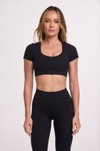 Load image into Gallery viewer, Buttery soft high waisted women&#39;s gym tights with practical pockets, sweetheart back seams for an upper glute shaping effect, and no front rise seam, paired with an V neck women&#39;s crop t-shirt with a supportive elasticated hem and triple layered fabric with removable pads for extra support in black
