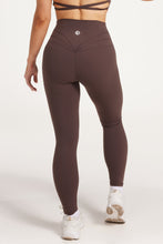 Load image into Gallery viewer, Buttery soft high waisted women&#39;s gym tights with curved hem stitched detailing for a butt shaping effect, and no front rise seam, paired with an open back women&#39;s crop t-shirt with a supportive elasticated hem and triple layered fabric with removable pads for extra support and aesthetic cross back straps in dark chocolate.
