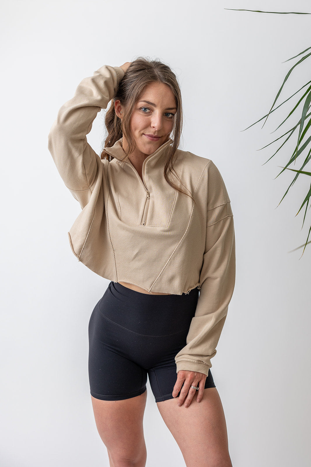 french terry cotton crop jacket with ribbed panels, raw edge hem and iconic embossed logo with half zip