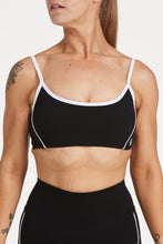 Load image into Gallery viewer, Womens scoops neck sports bra complete with white trim, elasticated hem, and supportive thick backstraps in black
