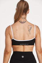 Load image into Gallery viewer, Womens scoops neck sports bra complete with white trim, elasticated hem, and supportive thick backstraps in black
