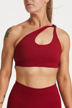 Load image into Gallery viewer, Cross over strap activewear bra in seamless fabric with adjustable back straps, and ribbed supportive underbust band in wine red
