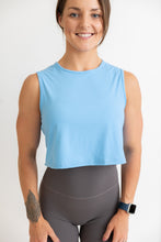 Load image into Gallery viewer, buttery soft crop length tank top in baby blue with subtle stitched logo tag
