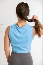 Load image into Gallery viewer, buttery soft crop length tank top in baby blue with subtle stitched logo tag
