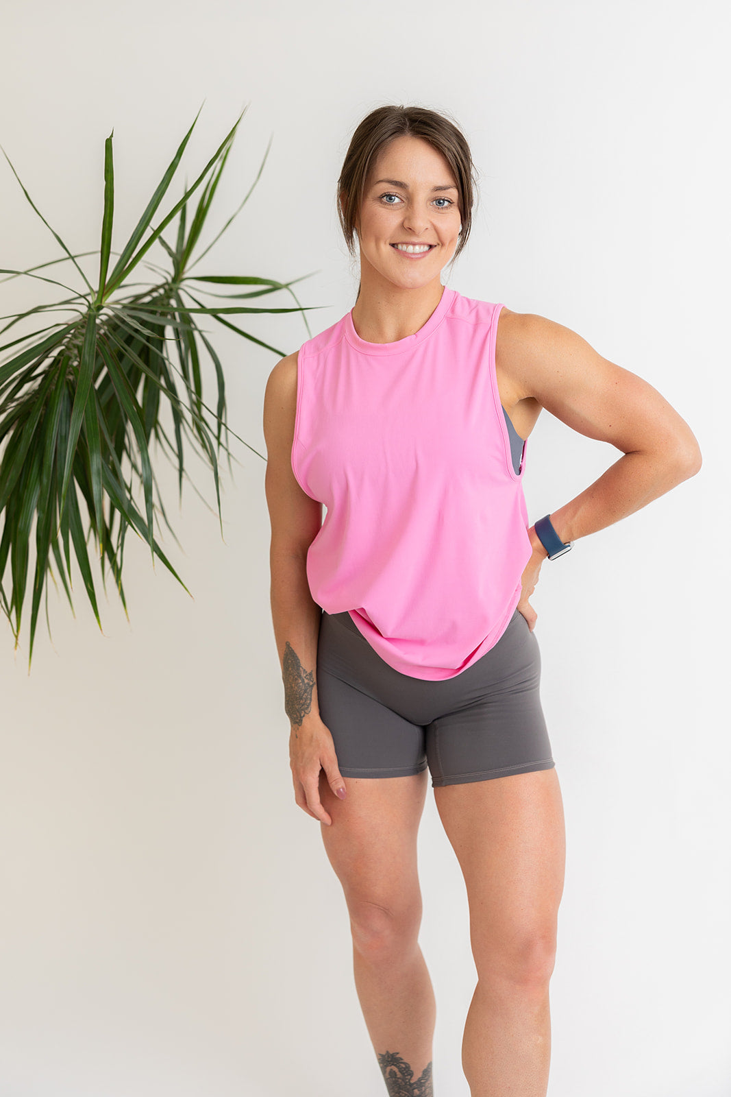 buttery soft tank top in baby pink with subtle stitched logo tag