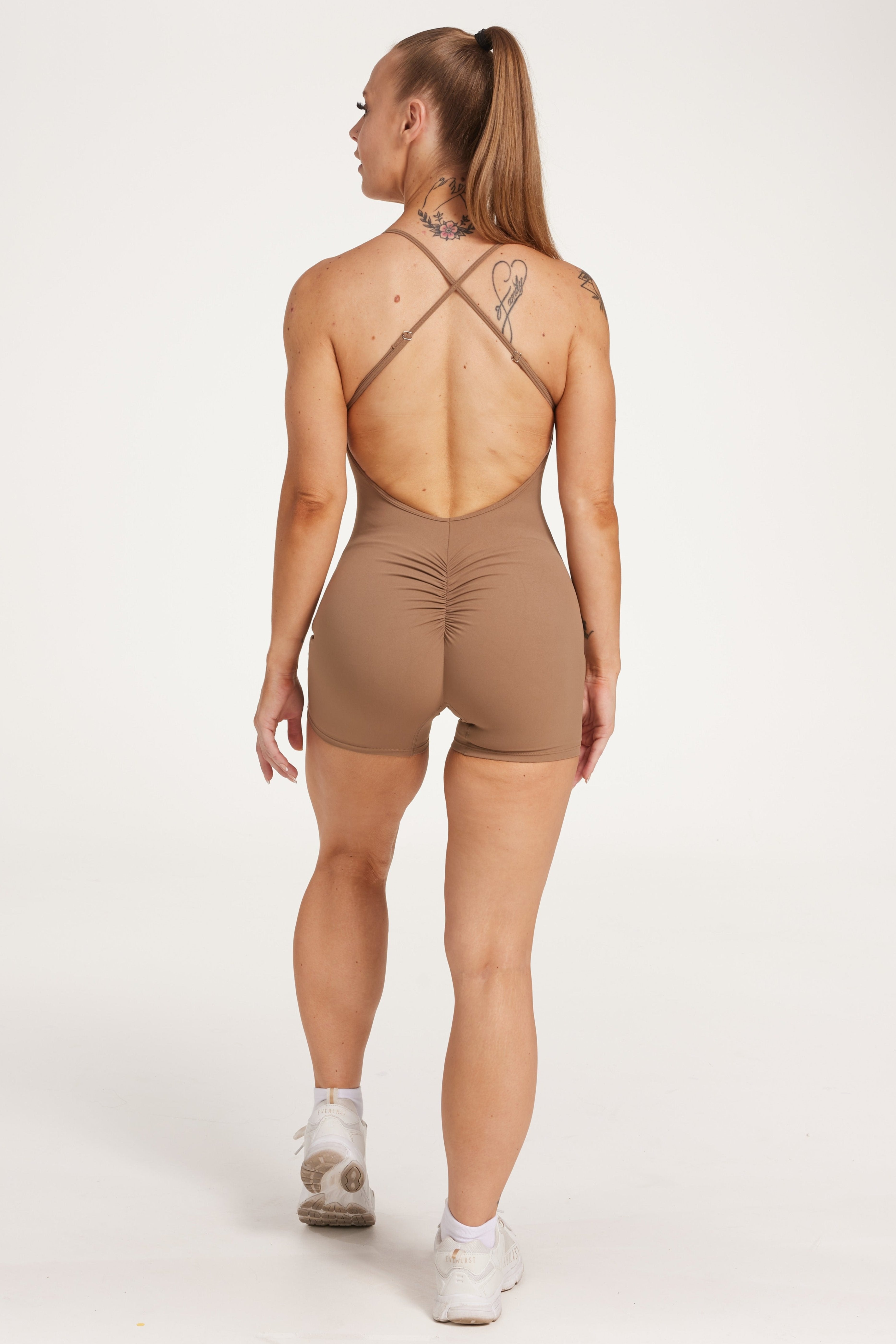 Womens bodysuit with scoop neck design, sleek adjustable cross over back straps scrunch butt effect in a buttery soft breathable fabric