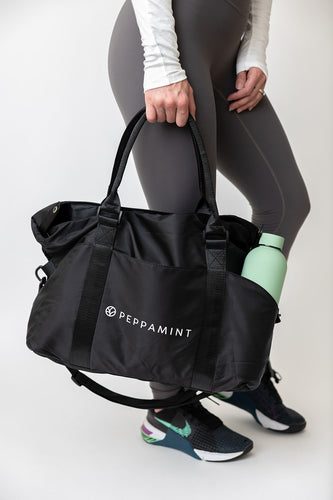 Carry all gym back in black with convenient carry handles + cross body handle attachment