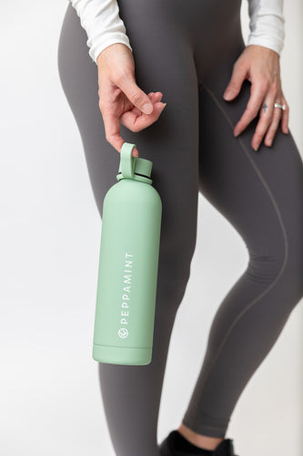 750ml stainless steel drink bottle in pastel green colour with convenient carrying handle