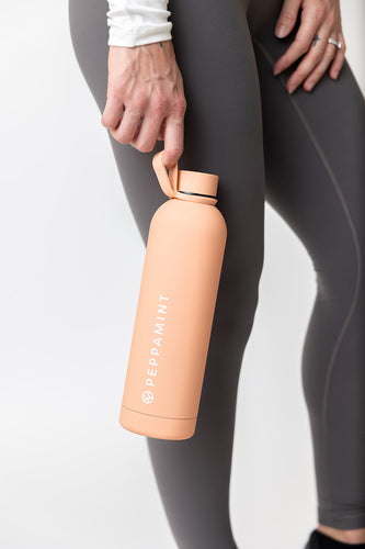 750ml stainless steel drink bottle in coral colour with convenient carrying handle