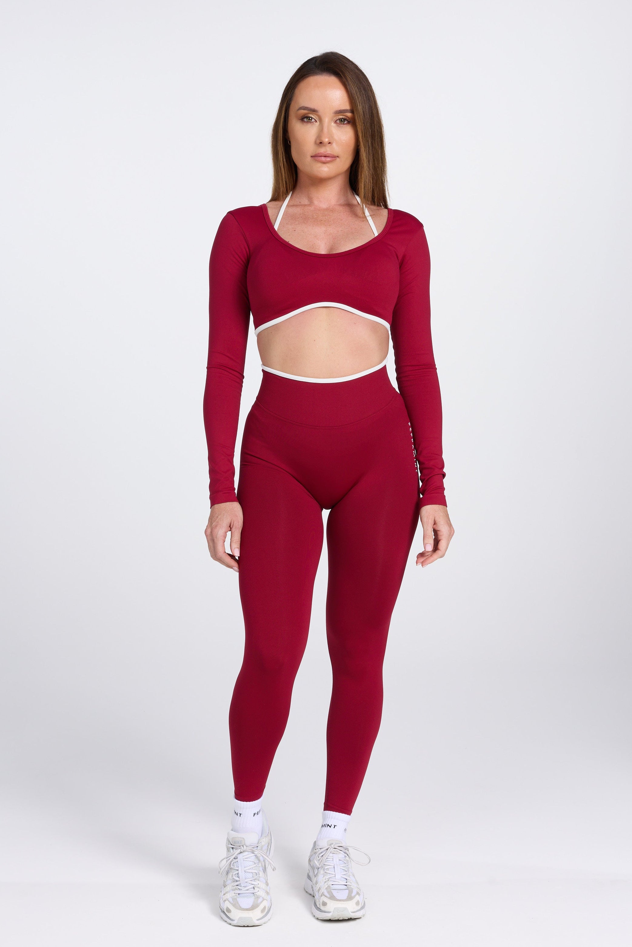 High waisted seamless gym tights, with textured booty sculpting panels, and a luxe white trim, in wine colour.