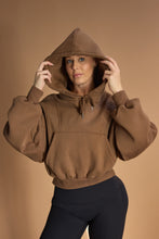 Load image into Gallery viewer, Oversize batwing hoodie, hip length, with slouchy oversized sleeves, piped seams, iconic ribbed panels and a kangaroo pocket with a hidden phone pocket inside in chocolate brown colour
