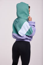 Load image into Gallery viewer, Hip length, full zip hoodie, with ribbed panels, embossed sleeve logo, in a slouchy oversize fit, in green, lavender and white.
