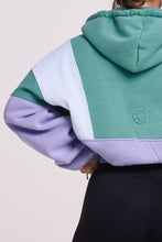 Load image into Gallery viewer, Hip length, full zip hoodie, with ribbed panels, embossed sleeve logo, in a slouchy oversize fit, in green, lavender and white.
