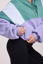 Load image into Gallery viewer, Hip length, full zip hoodie, with ribbed panels, embossed sleeve logo, in a slouchy oversize fit, in green, lavender and white.
