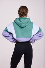 Load image into Gallery viewer, Hip length, full zip hoodie, with ribbed panels, embossed sleeve logo, in a slouchy oversize fit, in green, lavender and white.
