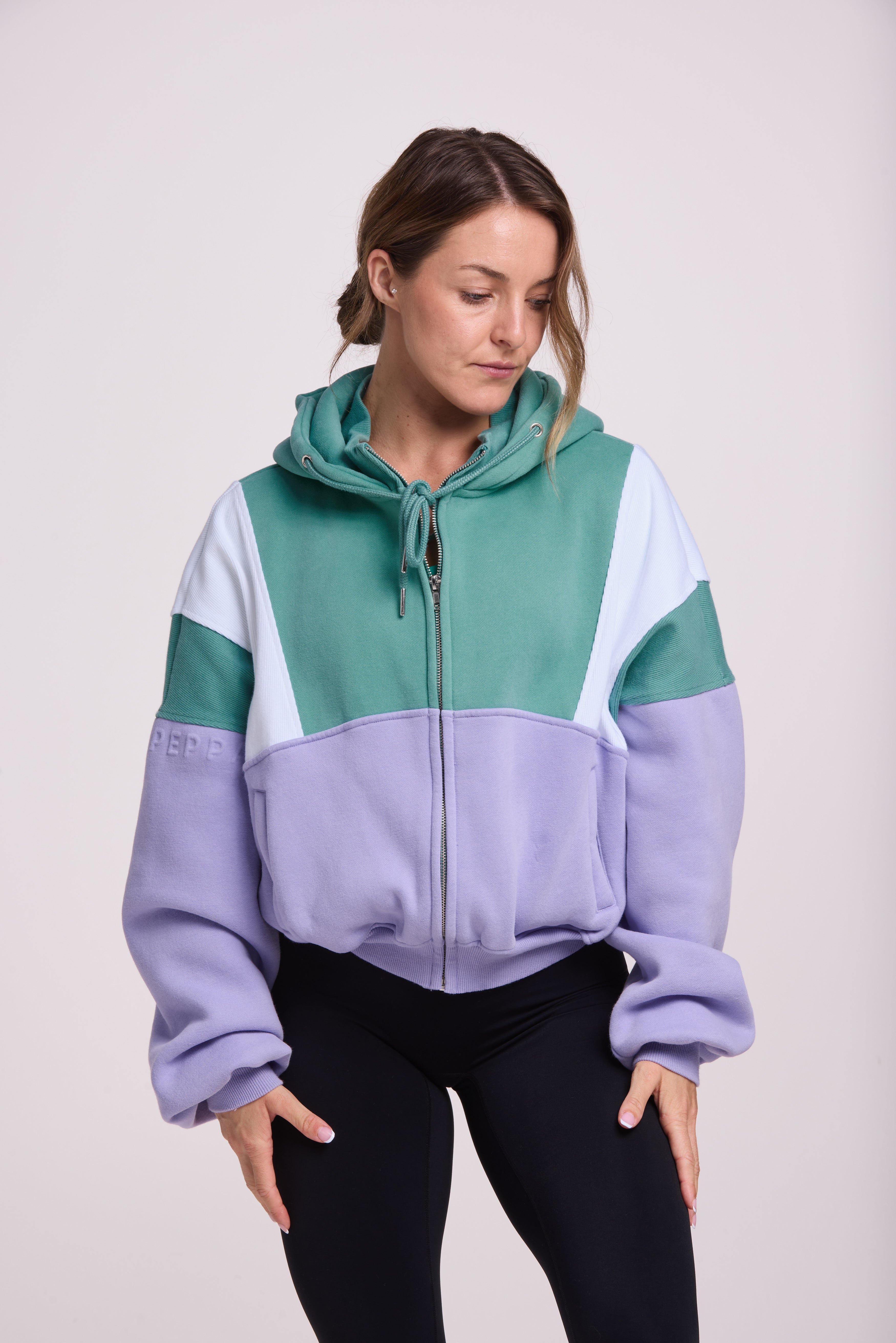 Hip length, full zip hoodie, with ribbed panels, embossed sleeve logo, in a slouchy oversize fit, in green, lavender and white.