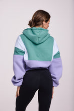 Load image into Gallery viewer, Hip length, full zip hoodie, with ribbed panels, embossed sleeve logo, in a slouchy oversize fit, in green, lavender and white.
