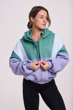 Load image into Gallery viewer, Hip length, full zip hoodie, with ribbed panels, embossed sleeve logo, in a slouchy oversize fit, in green, lavender and white.
