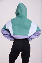 Load image into Gallery viewer, Hip length, full zip hoodie, with ribbed panels, embossed sleeve logo, in a slouchy oversize fit, in green, lavender and white.
