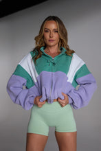 Load image into Gallery viewer, Hip length, full zip hoodie, with ribbed panels, embossed sleeve logo, in a slouchy oversize fit, in green, lavender and white.
