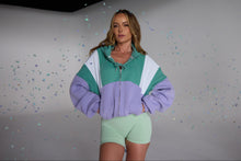 Load image into Gallery viewer, Hip length, full zip hoodie, with ribbed panels, embossed sleeve logo, in a slouchy oversize fit, in green, lavender and white.
