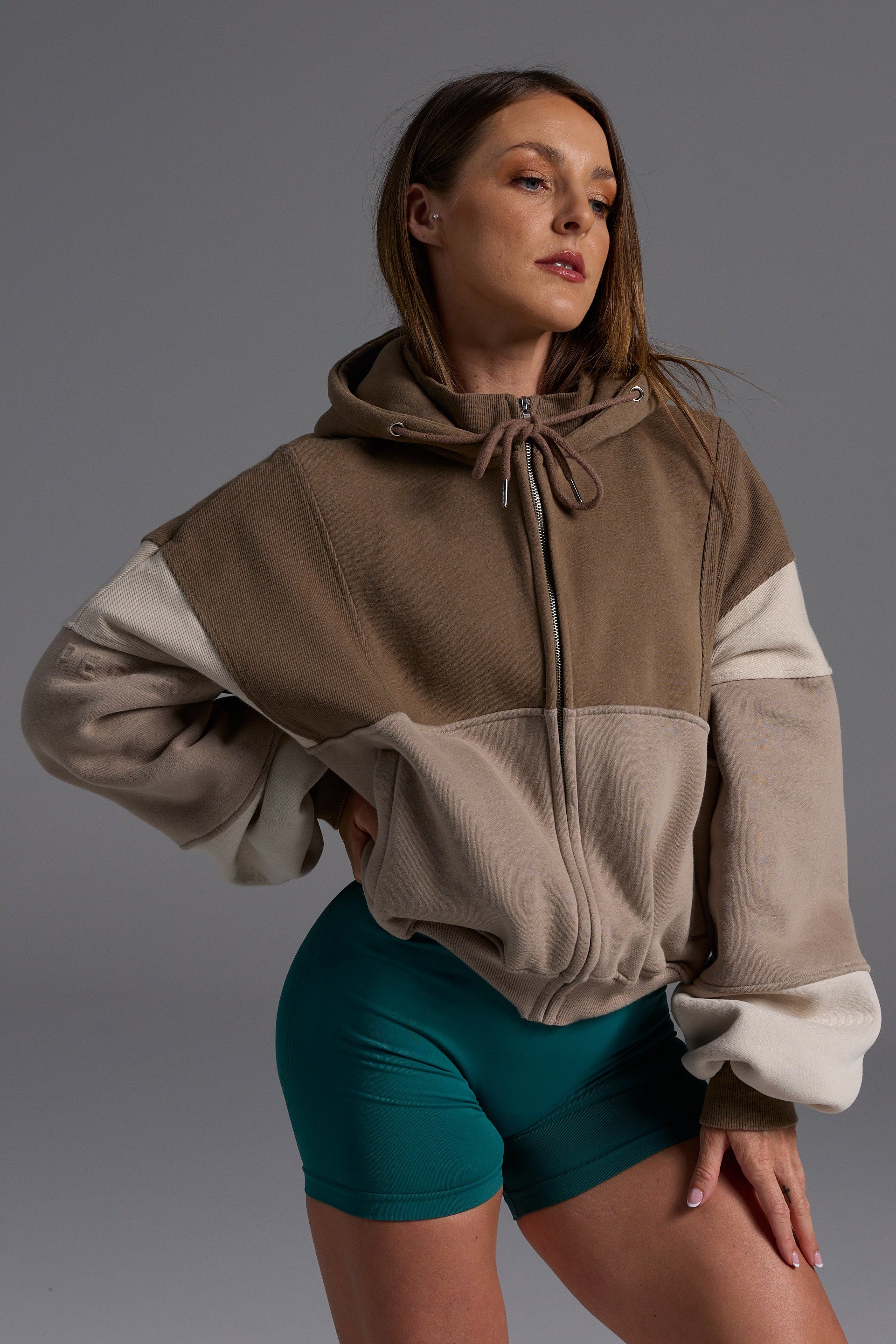 Hip length, full zip hoodie, with ribbed panels, embossed sleeve logo, in a slouchy oversize fit, with 2 convenient zip pockets, in mocha, stone and beige