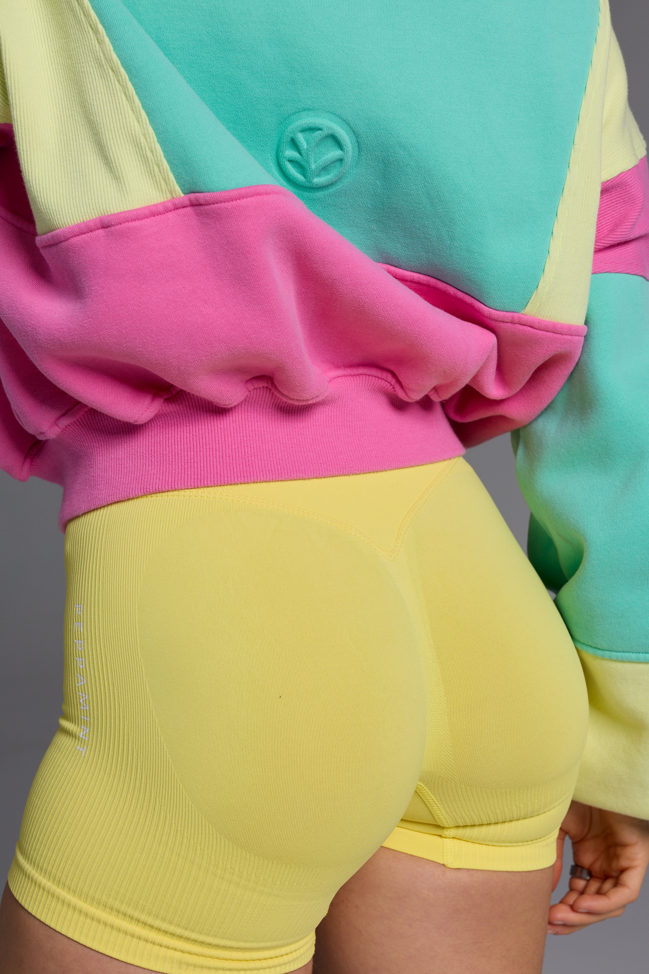 Hip length, full zip hoodie, with ribbed panels, embossed sleeve logo, in a slouchy oversize fit, with 2 convenient zip pockets, in neon pink, green and yellow.