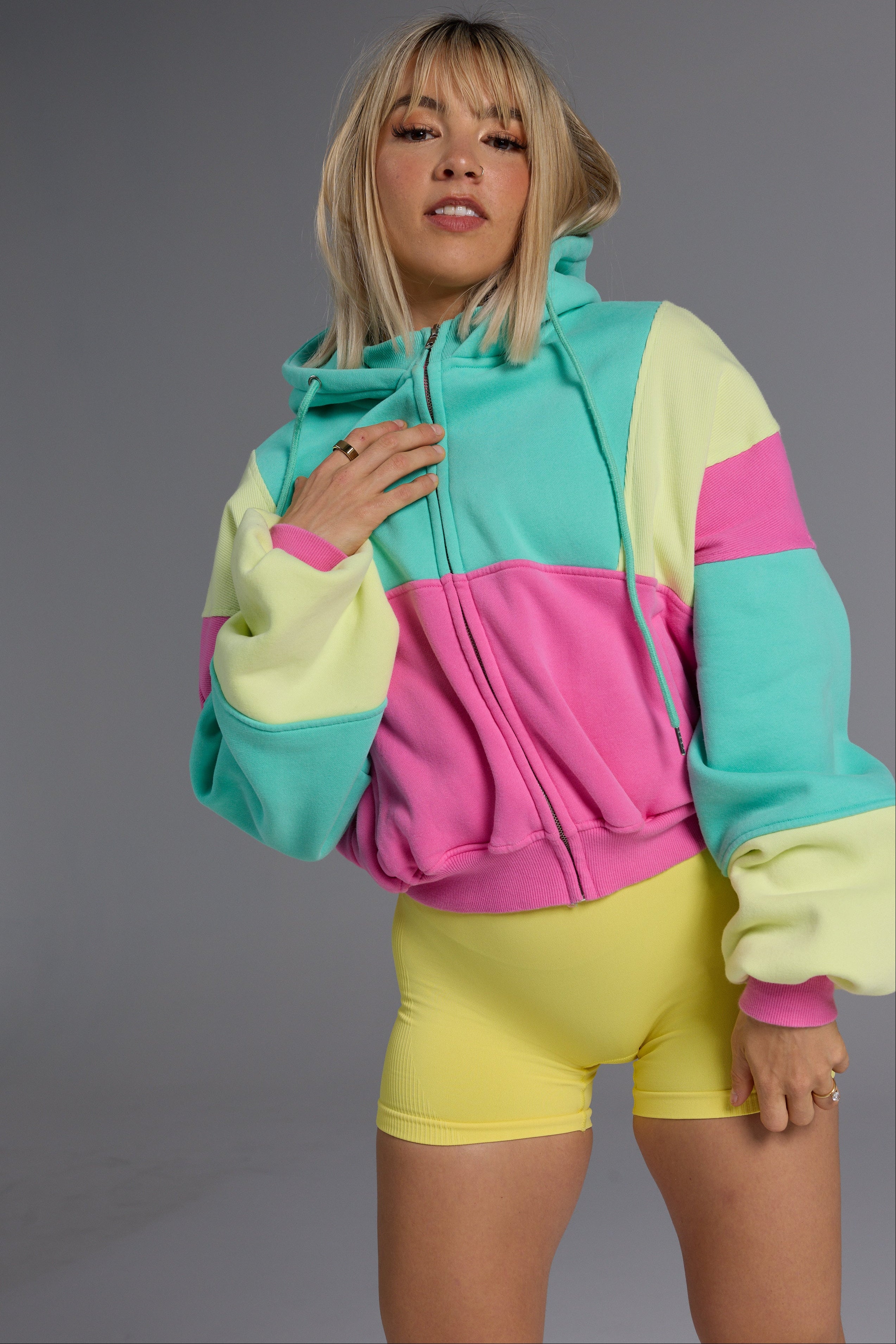 Hip length, full zip hoodie, with ribbed panels, embossed sleeve logo, in a slouchy oversize fit, with 2 convenient zip pockets, in neon pink, green and yellow.
