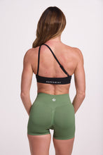 Load image into Gallery viewer, Front cross over strap activewear bra in seamless fabric with adjustable back straps, and ribbed supportive underbust band in black and seamless gym tights with booty contouring panels, invisible scrunch technology, sweetheart shaped back seams and thick supportive fabric in mermaid green

