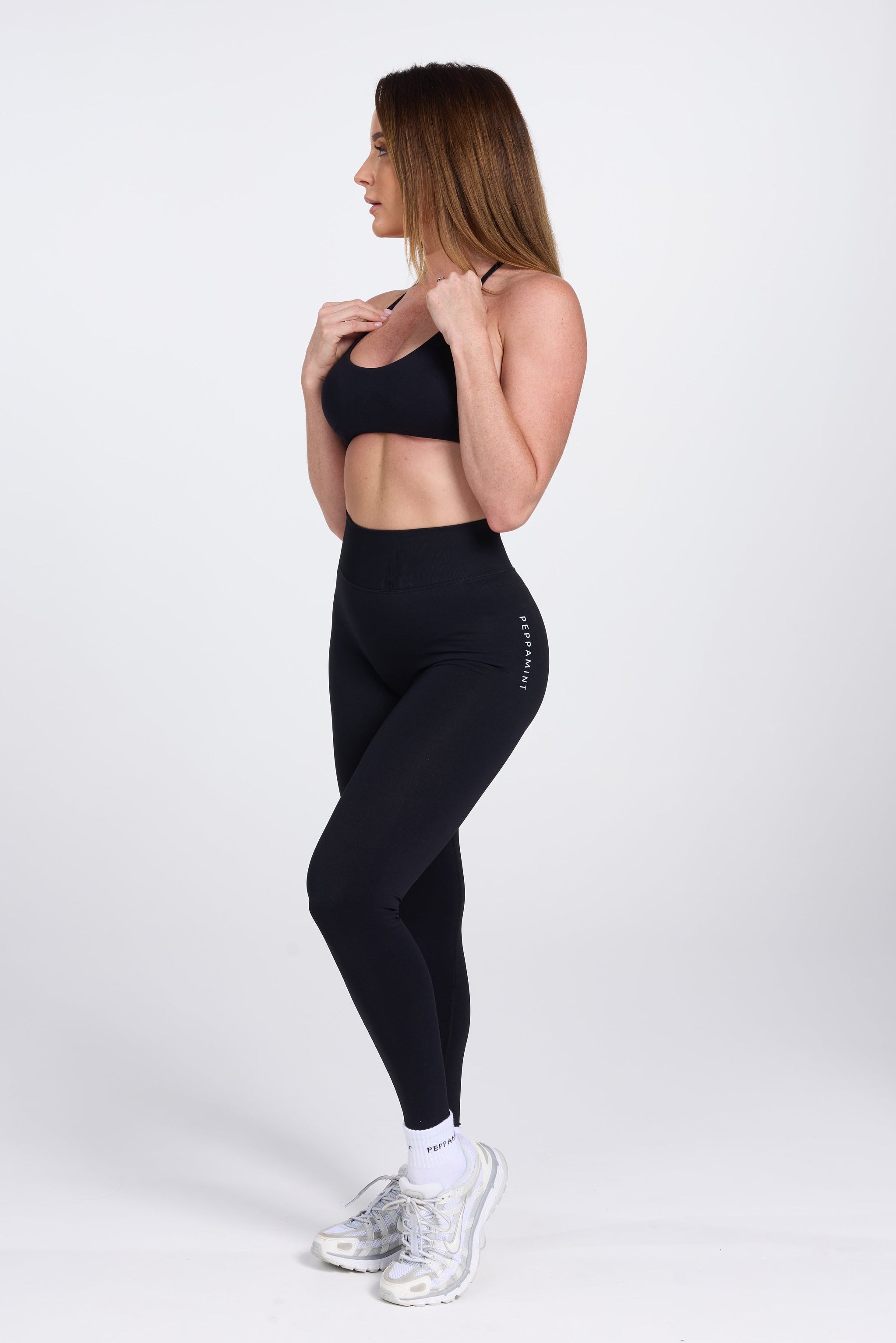 Seamless high waisted gym tights with booty contouring panels, invisible scrunch technology, sweetheart shaped back seams and thick supportive fabric in black