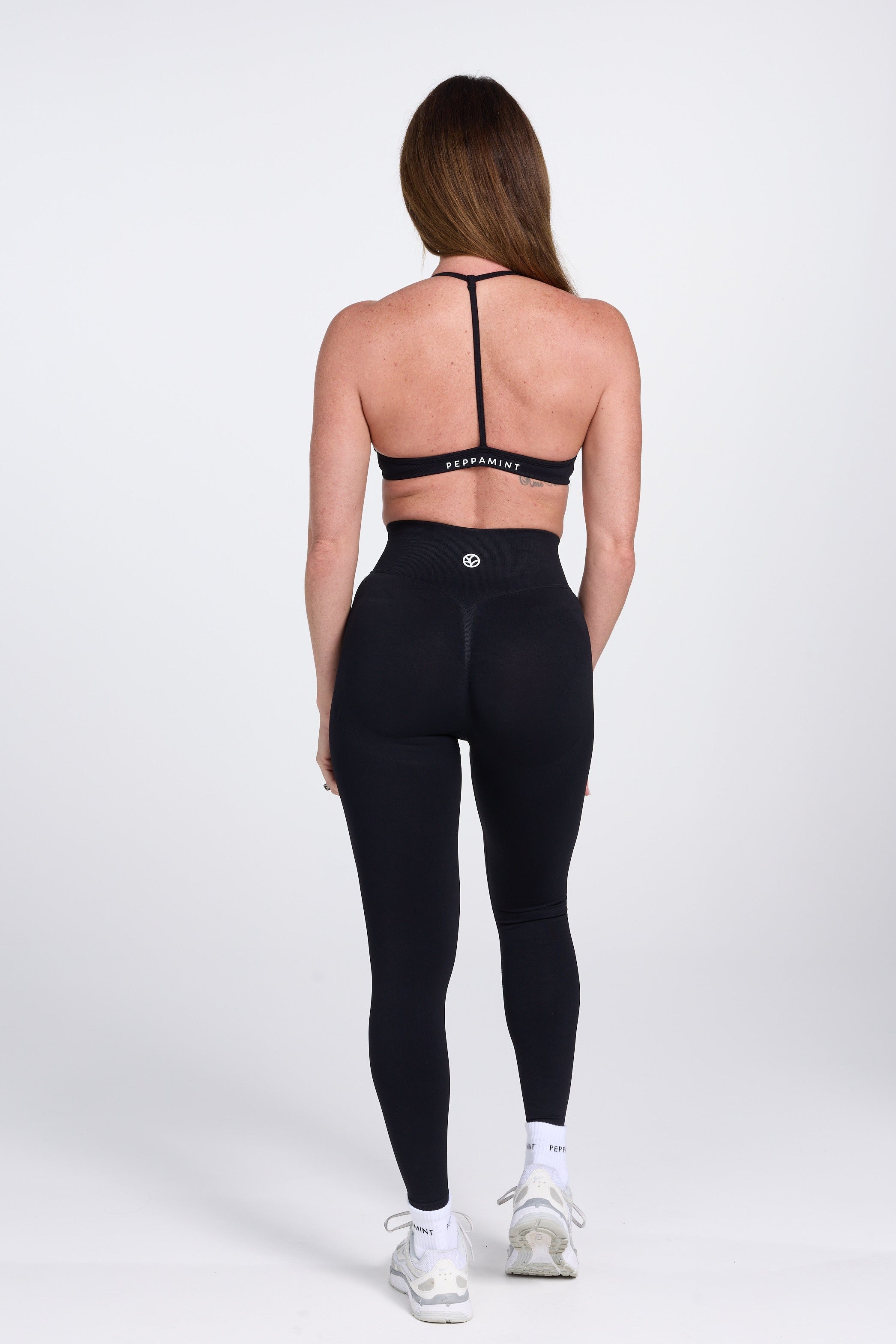 Seamless high waisted gym tights with booty contouring panels, invisible scrunch technology, sweetheart shaped back seams and thick supportive fabric in black
