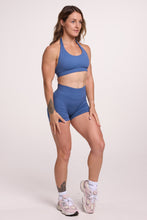 Load image into Gallery viewer, Seamless halter bra with a thick supportive fabric blend and a branded back strap, with a ribbed elastic hem and seamless gym tights with booty contouring panels, invisible scrunch technology, sweetheart shaped back seams and thick supportive fabric in grey blue colour
