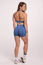 Load image into Gallery viewer, Seamless halter bra with a thick supportive fabric blend and a branded back strap, with a ribbed elastic hem and seamless gym tights with booty contouring panels, invisible scrunch technology, sweetheart shaped back seams and thick supportive fabric in grey blue colour
