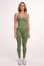 Load image into Gallery viewer, Halter neck tank top with breast contouring panels and a ruched front seam, a built in bra, and an open upper back design and seamless gym tights with booty contouring panels, invisible scrunch technology, sweetheart shaped back seams and thick supportive fabrics in mermaid green colour
