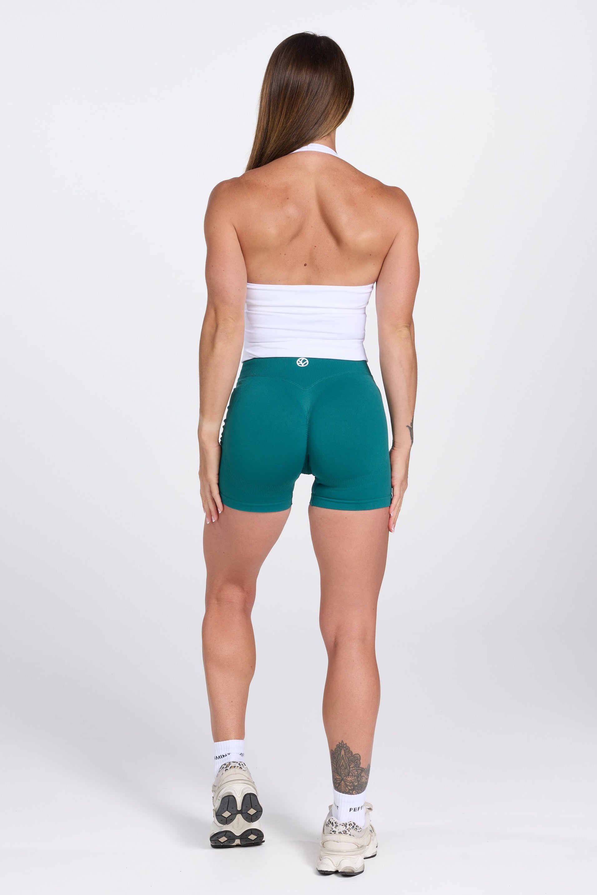 Seamless halter neck tank top, with supportive built in bra, U neck design and open back, with PEPPAMINT centre chest branding in white